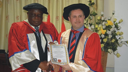 L-r: Oluropo Owolabi, managing director/chief executive officer of Skyway Aviation Handling Company Limited receiving the degree